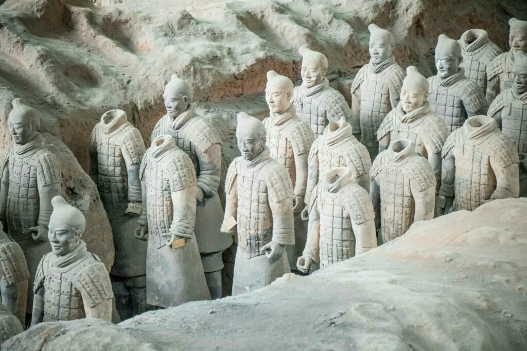 group of men in white robe statues